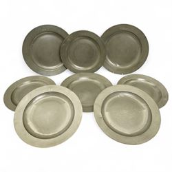 Eight large 18th century pewter chargers, each with impressed E and B, faint touch marks t...