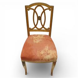 Edwardian pair of satinwood side chairs, each with shaped crest rail above an intertwining oval pierced splats centred by a floral patera, upholstered drop-in seats, raised on cabriole supports with applied floral mounts to the knees