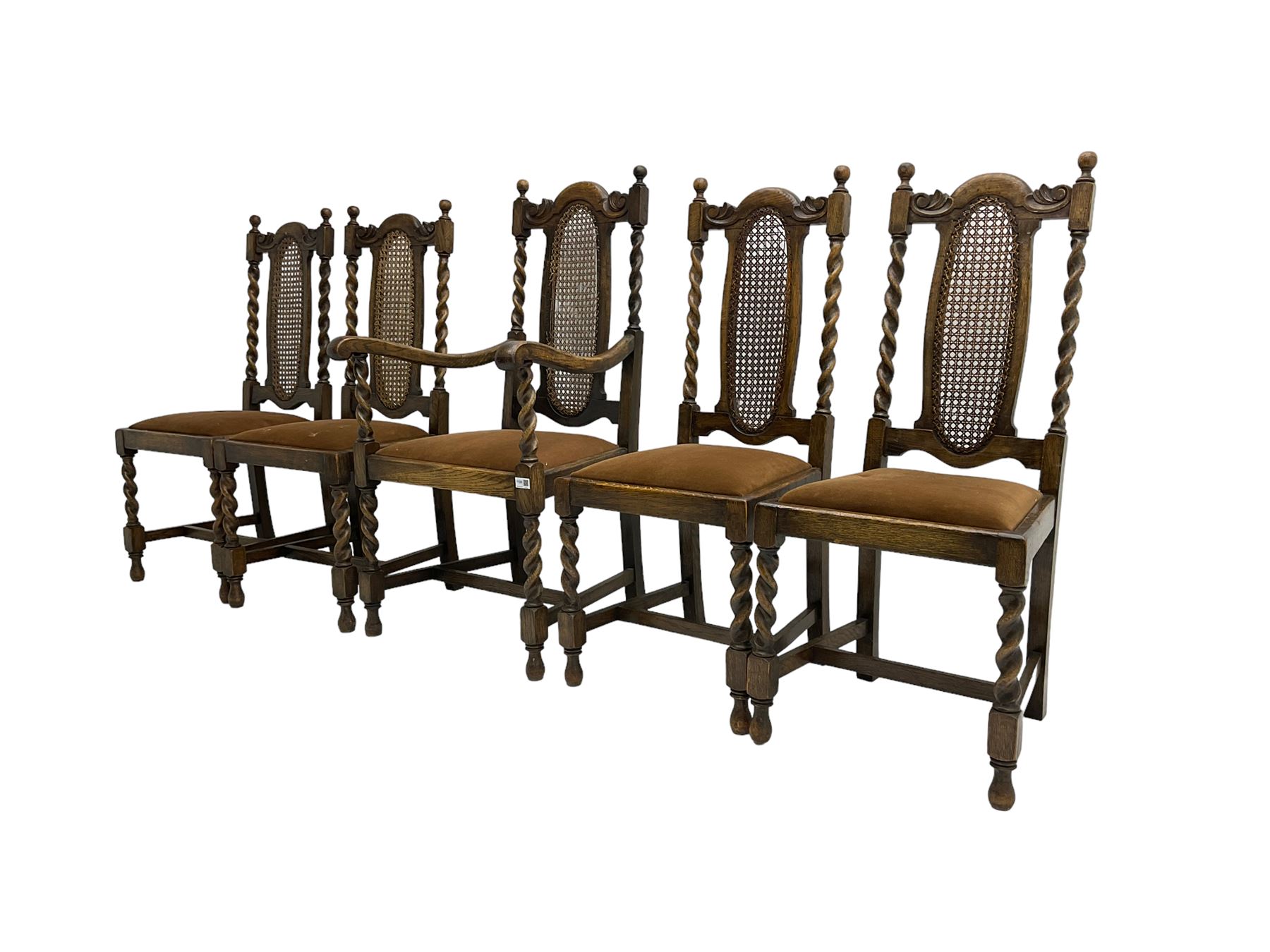 Set five early 20th oak barley twist dining chairs, spiral turned supports with oval cane-work backs, drop-in upholstered seats, on spiral turned supports joined by plain stretchers 