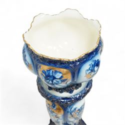 Staffordshire pottery jardiniere, decorated with flowers in blue and heightened in gilt, overall H46cm 