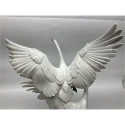 Large Lladro figure group, Swans Take Flight, modelled as two swans upon raised on circular wooden plinth, sculpted by Salvador Debon, H68cm