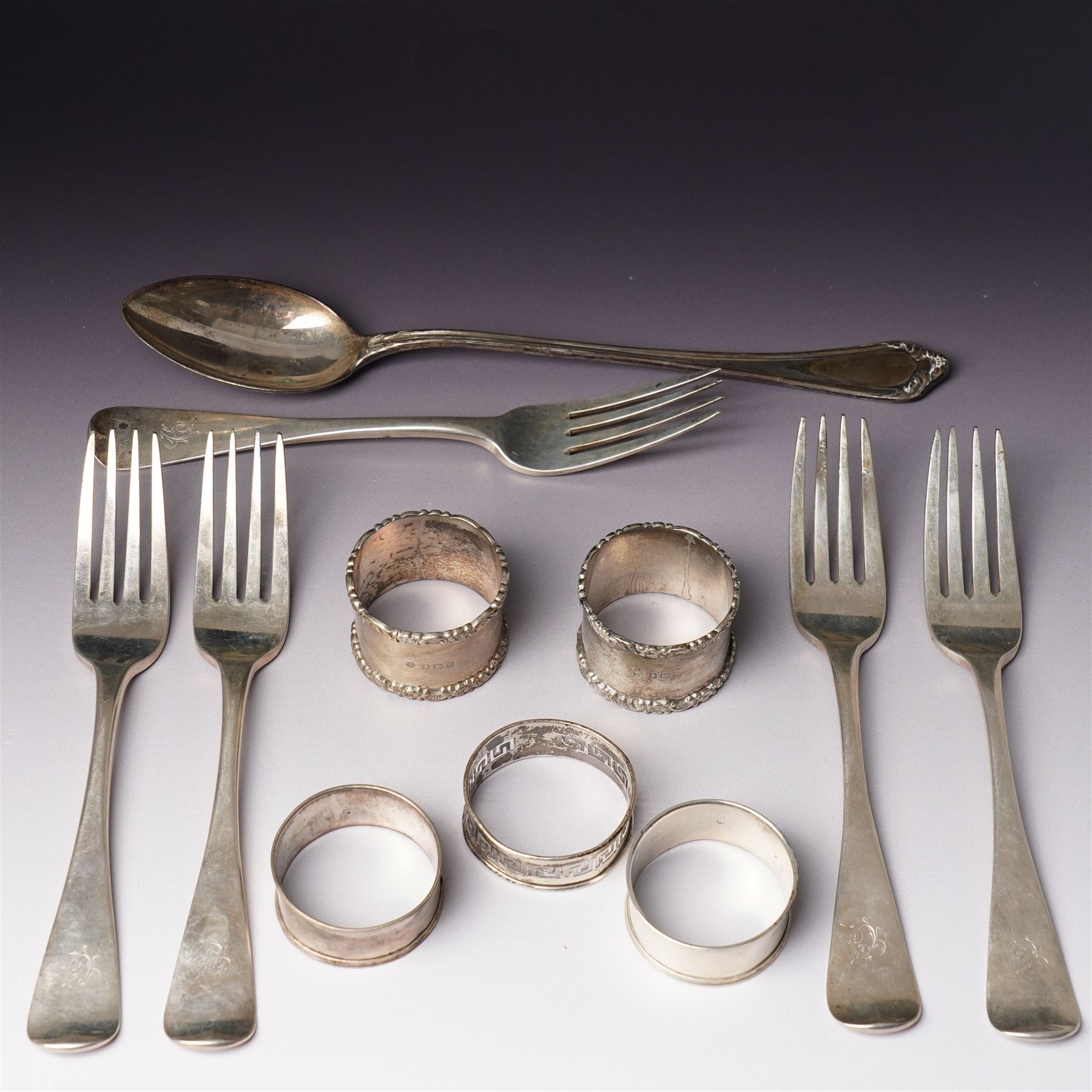 Five George IV Scottish silver table forks engraved with initial Glasgow 1829 Maker G Thomson, one German silver (800) spoon and five silver serviette rings