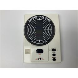 Three late 70s/early 80s handheld electronic games; Bandai Electronics Arcade ‘Gunfighter’ (1980), Grandstand ‘Invader From Space’ (1980), Palitoy ‘Merlin The Electronic Game Machine’ (1979) with game sheet and instruction booklet, all with original boxes (3) 