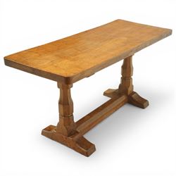 Mouseman - oak rectangular adzed coffee table, octagonal supports united by stretcher terminating in sled feet, with carved mouse signature, by the workshop of Robert Thompson of Kilburn 