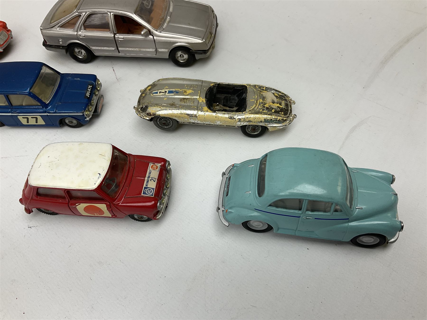 Corgi - thirty unboxed and playworn/repainted die-cast cars including Triumph Herald Coupe, BMC Mini-Cooper 'S', Porsche Carrera, two 'E' Type Jaguars, Rover 2000TC, three Morris Minors, two Aston Martin DB4, two Volvo P1800, MGA, Fiat 2100, Jaguar 2.4 Litre, Jaguar Mark X Saloon etc (30)