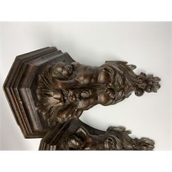 Pair 19th century carved oak wall brackets, each with canted top with carved support in the form of a Green Man mask flanked by two caryatid, and scrolling foliate terminal, H29cm