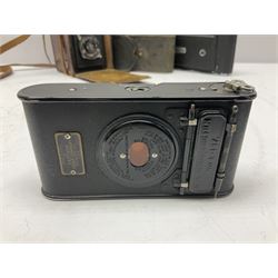 Zeiss Ikon Telma camera, Voigtlander Brillant camera, Vest Pocket Kodak camera, and two AA badges