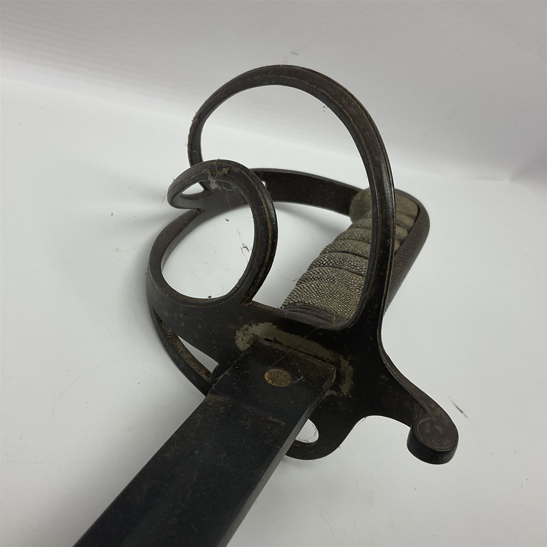 WW1 British Army 1897 Pattern Officers Sword, the 80cm fullered steel blade with traces of decoration and inscribed 'W.E. French 1914'; the basket hilt pierced with the George V cypher and wire-bound fish-skin grip L97cm overall; and WW1 British 1821 pattern Royal Artillery officer's sword with three-bar hilt; both lacking scabbard (2)