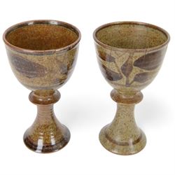 David Lloyd Jones (1928-1994): set of four studio pottery goblets, with foliate decoration on a mottled brown ground, together with two small stoneware bowls by the same artist, with stylised bird border on an orange brown ground, all with impressed marks beneath, goblets H15.5cm