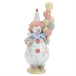 Four Lladro clown figures, comprising Having a Ball 5813, Little Clown 5811, Clown with Puppy 5278 and Pierrot with Concertina 5279