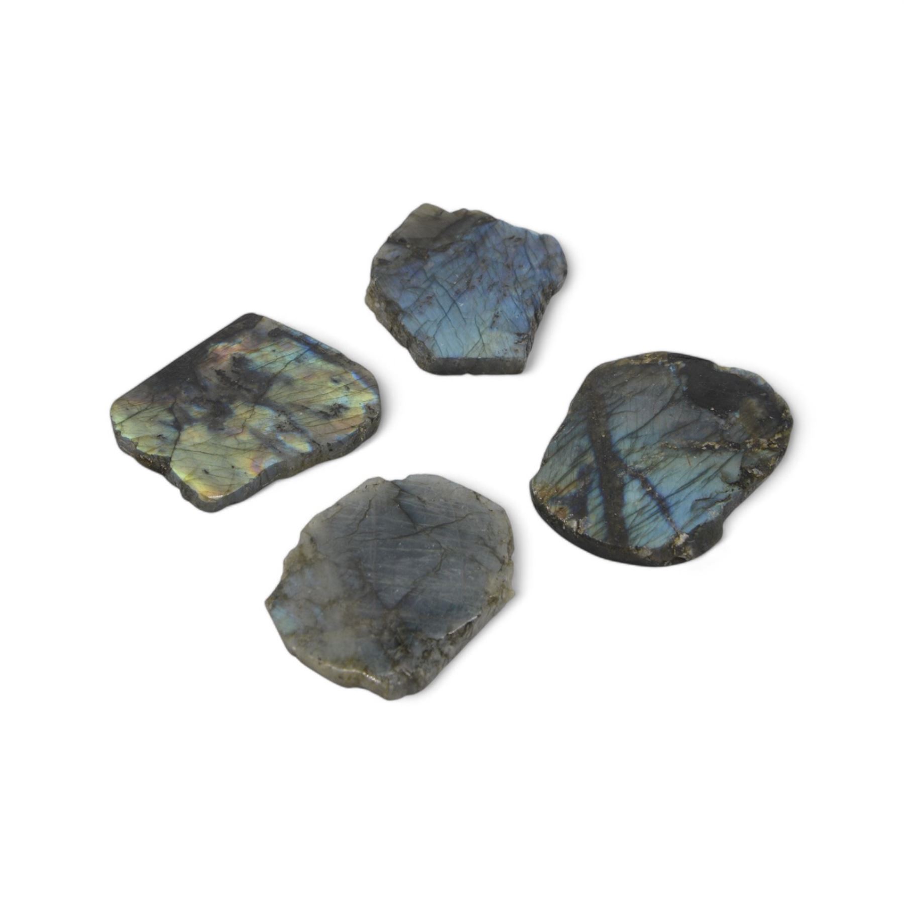Four polished labradorite coasters with raw edges, approximate D8cm