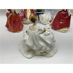 Five Royal Doulton figures, comprising Flower of Love HN3970, Emily HN3688, Southern Belle HN2229, Helen HN3886 and My Love HN2339, all with printed mark beneath, some with boxes, together with a Royal Doulton Figures reference book by D Eyles and R Dennis