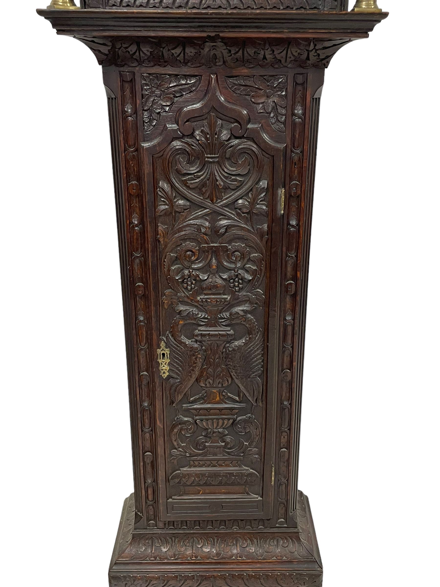 18th-century profusely carved oak longcase clock - with a pagoda pediment, upstands and carving, 
 break arch hood door flanked by reeded pilasters with brass capitals, trunk with canted corners and a spire topped door, square plinth with applied skirting, break arch brass dial with wheatsheaf engraving and cast cherub and crown spandrels, engraved break arch with the London clockmakers name John Gordin, silvered chapter ring with Roman numerals, five minute Arabic's, minute and quarter hour tracks, matted dial centre with ringed winding holes, square date aperture and seconds ring, dial pinned to a five pillar movement with inside countwheel striking, striking the hours on a cast bell. With weights and pendulum. John Gordin, is possibly a mis-spelling or phonetic spelling of John Gordon, of London, who worked from Ludgate Street in the parish of St. Gregory by St. Pauls. Apprenticed in 1689 and died in 1732 when his will was proven.
