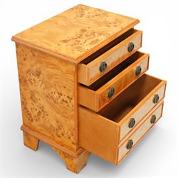 20th century burr walnut reproduction chest, rectangular moulded top over three long drawers, each fitted with circular ring handles, plain sides, raised on shaped bracket feet
