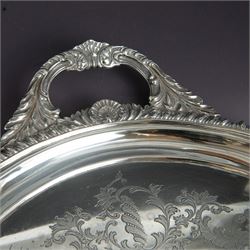 Victorian silver twin handled tray, of oval form, engraved with floral and foliate swags with vacant cartouche to centre, with oblique gadrooned rim, palmette details and foliate decoration to handles, hallmarked Atkin Brothers, Sheffield 1901, handle to handle W70cm