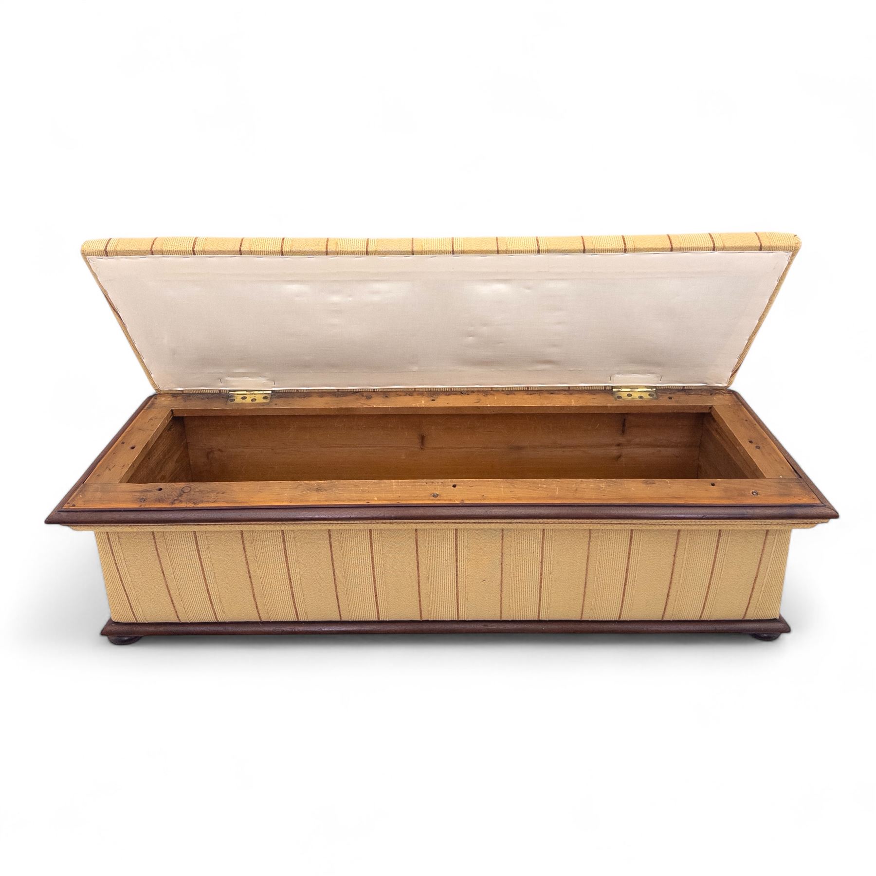 Late Victorian angular framed mahogany bay window seat, hinged lid with moulded upholstered padded seat, over upholstered front and sides, raised on compressed bun feet  