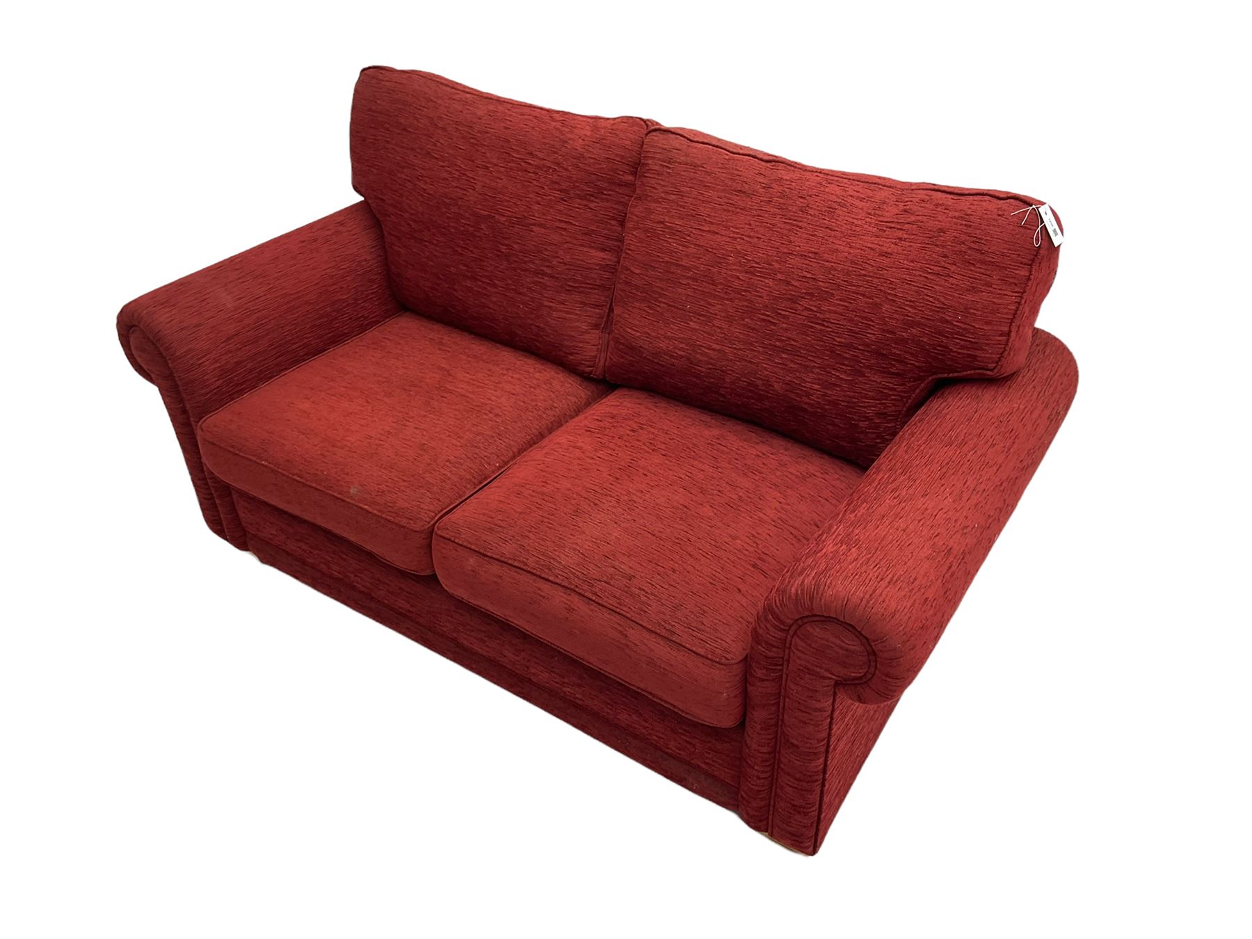 Two seat metal actions sofa bed upholstered in red cover The