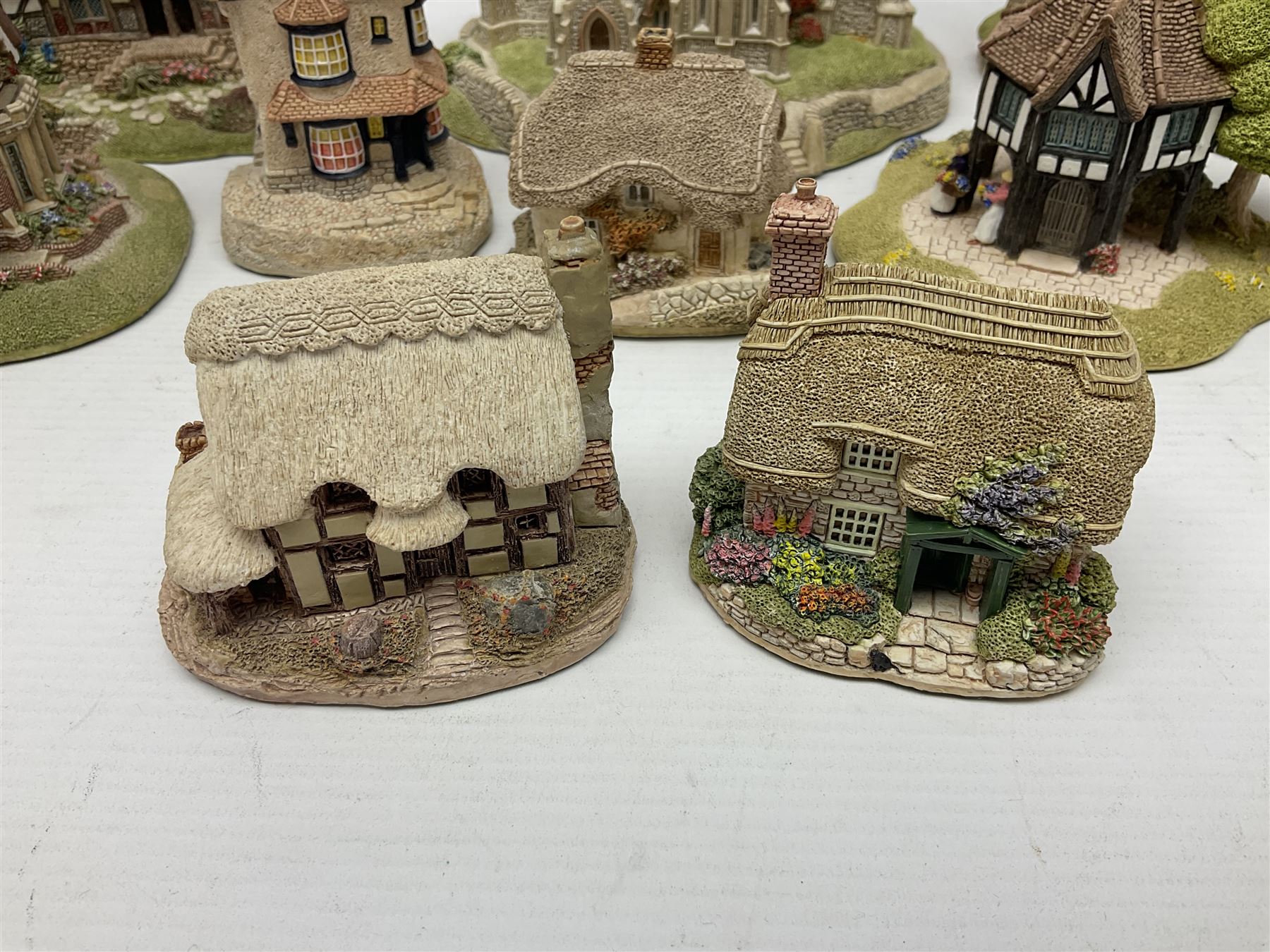 Twelve Lilliput Lanes, including Old Shop Bignor, Dial Cottage, Paradise Lodge, etc, some with deeds and original boxes