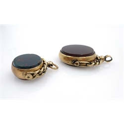  Two hardstone swivel fobs, gold mounted stamped 10ct and hallmarked 9ct, 3cm and 2.5cm diameter   