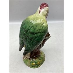 Three Beswick figures of birds, comprising pheasant no 1225, magpie no 2305 and woodpecker 1218, all with impressed marks beneath, tallest H22cm