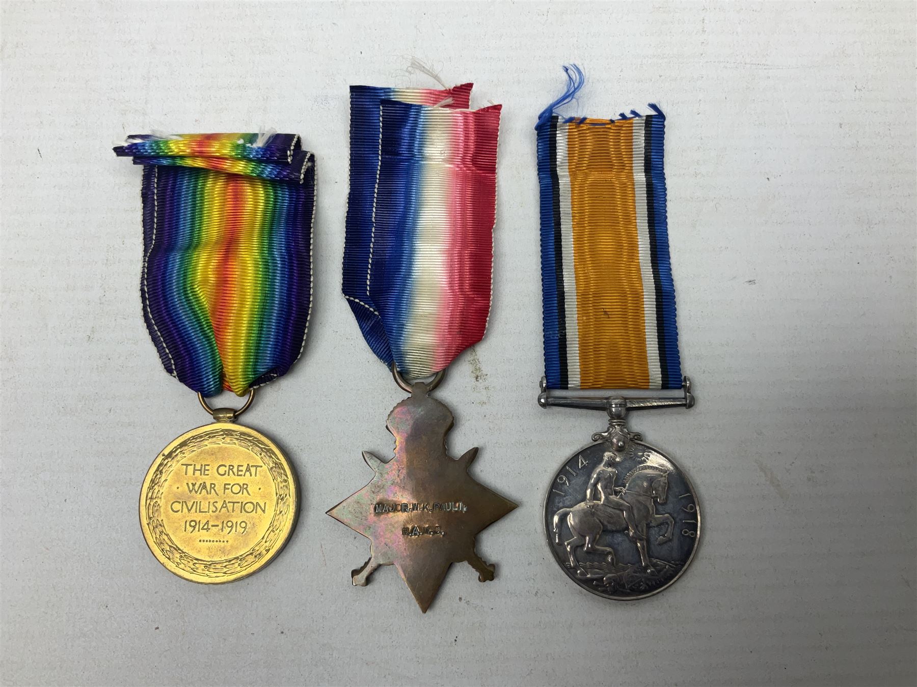 WW1 group of three medals comprising British War Medal, 1914-15 Star and Victory Medal awarded to Major W.K. Pauli R.A.M.C.; with ribbons; some biographical details