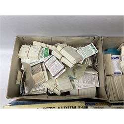 Over eighty trade card albums by Brooke Bond, Lyons, PG Tips, Hornimans, Ty-Phoo etc including some duplicates; and large quantity of loose trade cards