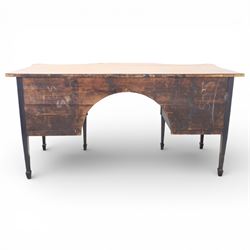 Early 20th century mahogany bow front sideboard, the shaped and moulded top above central kneehole recess with baize lined frieze drawer, flanked by twos drawers either side with the lower drawer double height, raised upon square tapering legs with spade feet