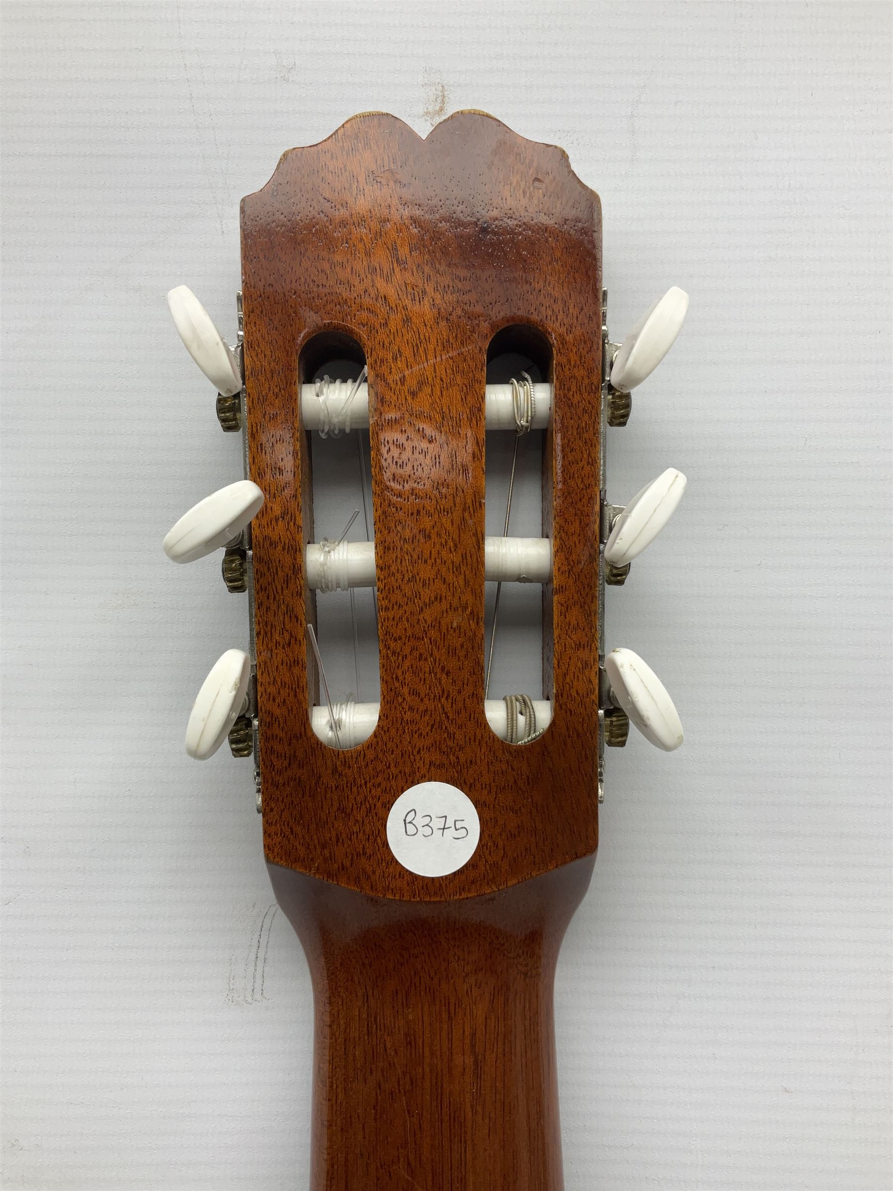 Spanish BM acoustic guitar with mahogany back and sides and spruce top L101cm; in cello carrying case; Roland foot pedal and two Yamaha foot pedals; tin D# organ pipe; folding music stand etc