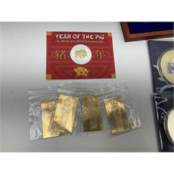 Mostly commemorative and fantasy coinage including commemorative crowns, 2018 'The Capsule Edition featuring the 2018 Paddington 50p coins' in display case, The Royal Mint Solomon Islands 2007 one ounce fine silver five dollars coin on card etc