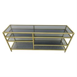 Modern glass and gilt metal media stand, rectangular smoked glass top panel set within a gilt finished metal surround, raised on square section legs, the underside fitted with a full-width glass shelf