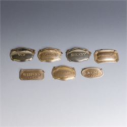 Five silver decanter labels, of varying design, including Bacardi, Vodka, Rum, Brandy and ...