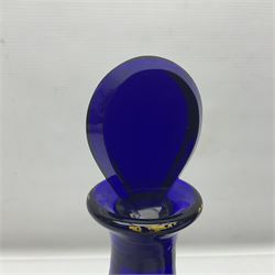 Pair of early 19th century blue glass decanters with teardrop stoppers, with gilt writing, the first marked Gin the second Brandy 