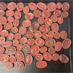 Large and impressive collection of Grand Tour cameos and intaglios (impronte), mostly red plaster examples