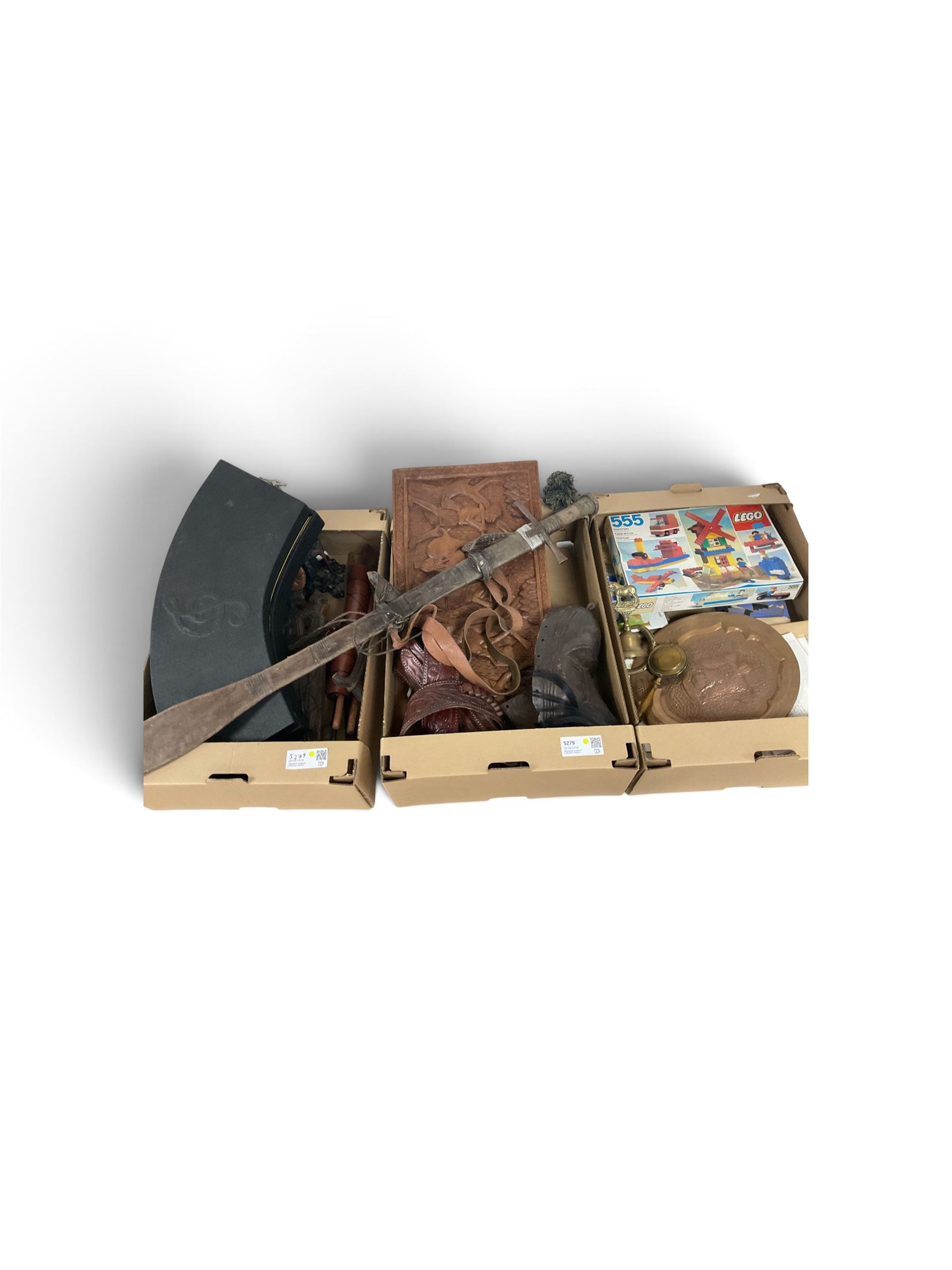 Cased display of miniature musical instruments, together with wooden carvings and other items, in four boxes  