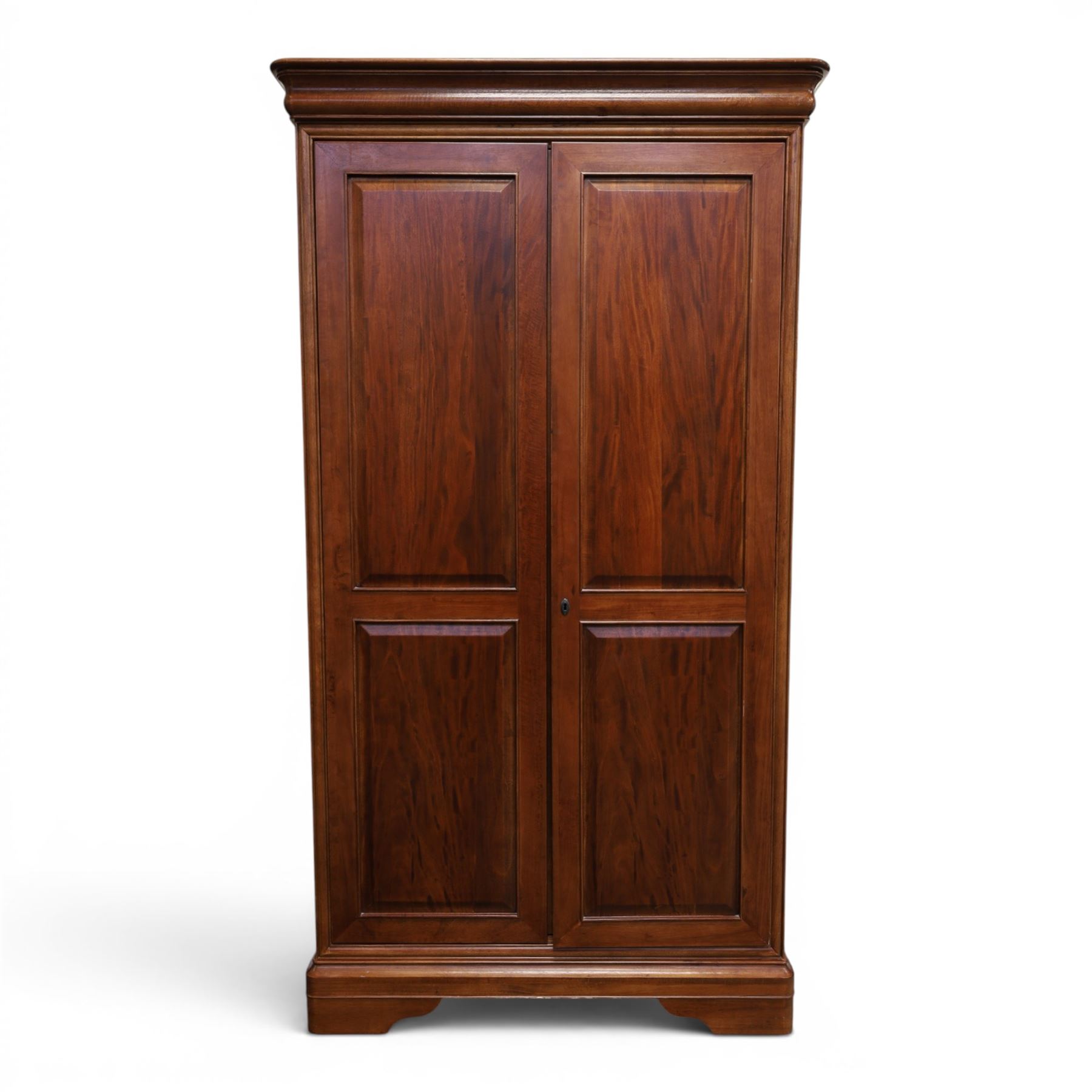 Willis & Gambier - mahogany bedroom wardrobe, projecting cornice with two additional rails, panelled doors with trouser rack and blue baize trinket, enclosing a shelf above a wooden clothes rail and shoe rack, raised on bracket feet 