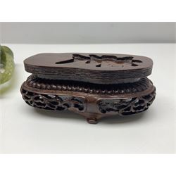 Carved jade figure of a phoenix perched on a flowering branch, upon a wooden stand, with original box, H27cm