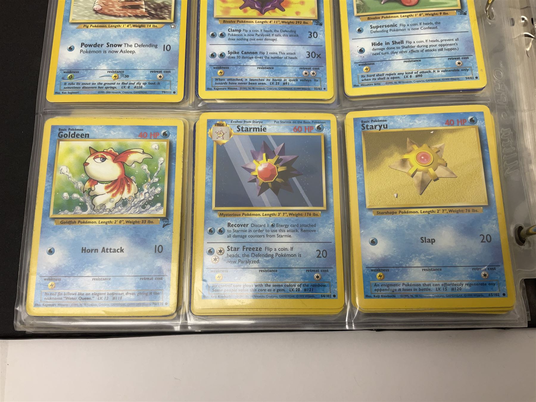 Collection of Pokemon trading cards, mostly 1999 Wizards Pokemon cards to include holo Charizard 4/102, first edition holo Machamp 8/102, further holographic cards; Dark Flareon 35/82 and Dark Vaporeon 45/82, cards from themed sets and 4th edition prints; 1998 Electronic Pokédex with cardboard boxes for themed decks Blackout, Overgrowth and Power Reserve Jungle, along with a large quantity of energy and trainer cards 