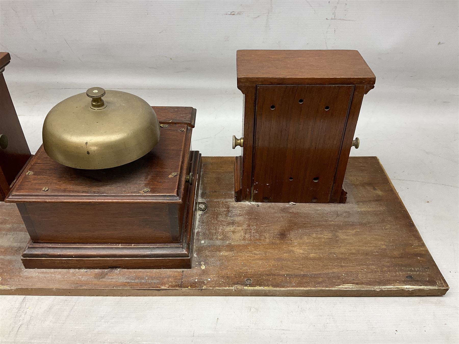 Railway signal boxes, mounted on plinth, with railway block indicators for Up Line and Down Line, having an electromagnetic indicator showing 'Train on Line' 'Line Clear' and 'Line Blocked', and brass signal bell to the centre, L100cm
