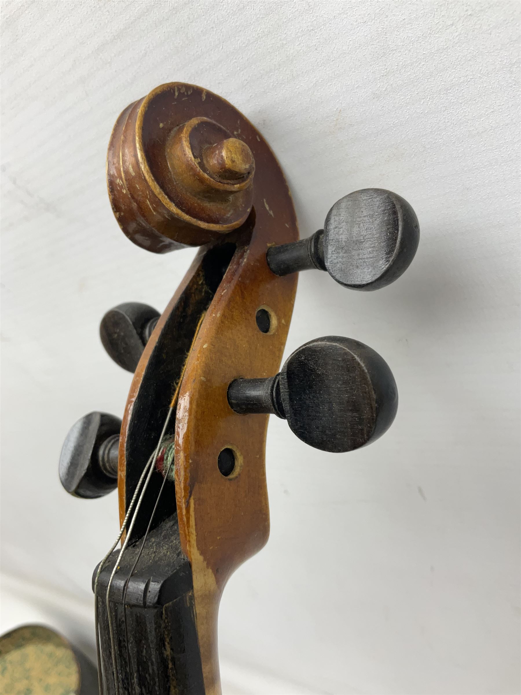 Czechoslovakian violin c1920 with 36cm two-piece maple back and ribs and spruce top, bears label 'Copy of Antonius Stradivarius Made in Czechoslovakia' L59cm; in carrying case; 1950s Czechoslovakian violin; and 195os Czechoslovakian three-quarter size violin; both cased (3)