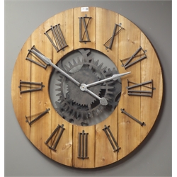 Large circular planked pine wall clock with Roman numerals, skeleton simulated workings with battery movement, Diameter - 80cm  