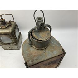 Two WW2 period ship's bow-fronted lamps with grey painted finish, each impressed G.P. Ltd and dated 1943 and 1944; lacking oil burners; one with hinged hanging bracket H28cm excluding bracket; and Lamp Manufacturing & Railway Supplies Ltd Welch patent style lamp of square section with four glazed panels and original oil burner H25cm excluding swing handle (3)