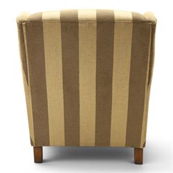 Alstons - 'Ixworth' armchair, upholstered in striped fabric, with loose seat cushions and scrolled arms, brass front castors