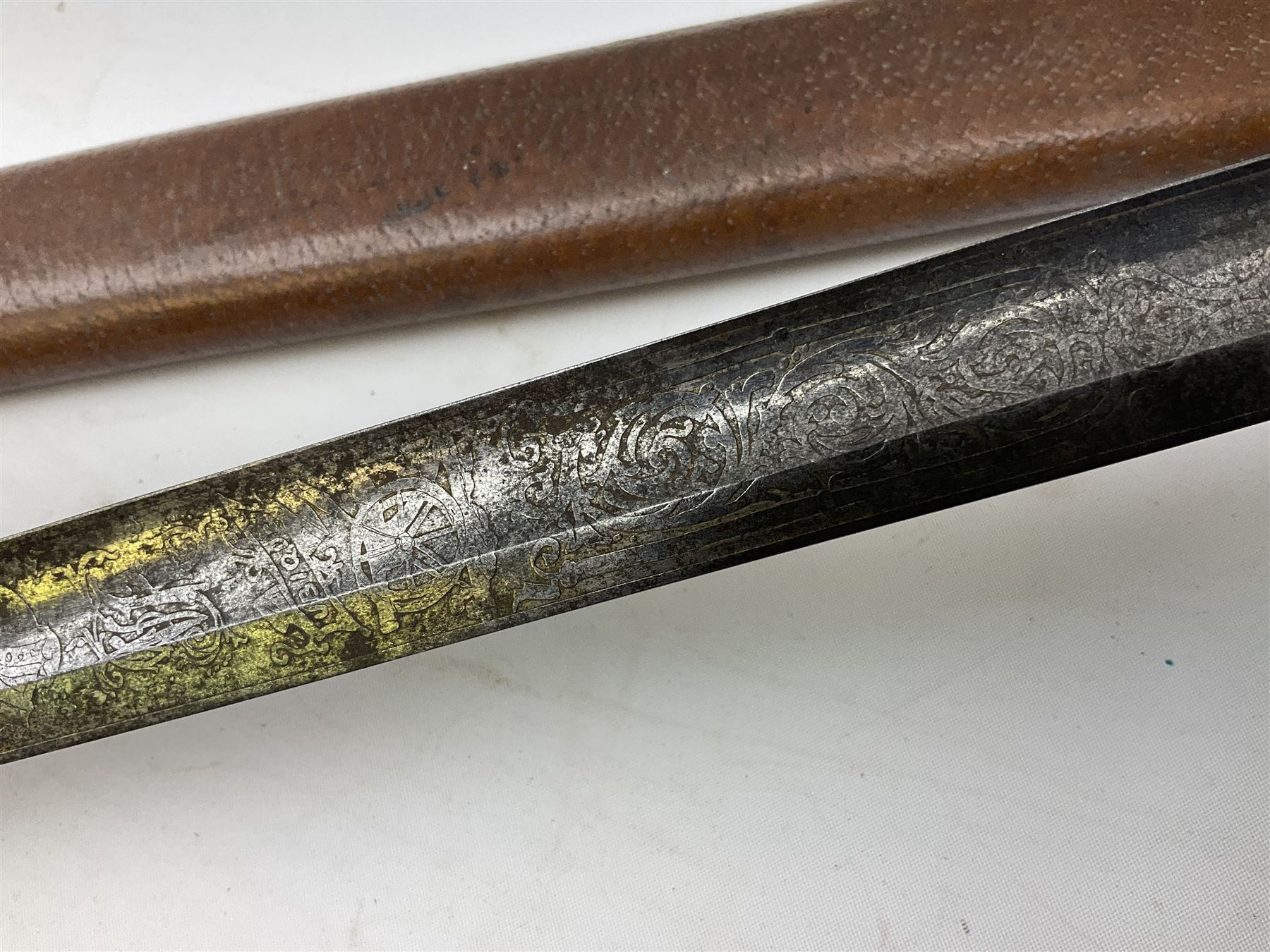 Victorian artillery officer's sword, the 90cm fullered steel blade by E. Thurkle Denmark Street Soho London decorated with Victoria cypher, Regimental crest and 'Royal Artillery', three-bar hilt with stepped pommel and wire-bound fish skin grip; in leather covered scabbard L107cm overall