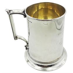 Victorian silver tankard of slightly tapering cylindrical form with engraved dedication to body, and angular scroll handle, upon a flared foot with beaded border, hallmarked Birmingham 1868, H14cm, approximate weight 13.76 ozt (428.2 grams)