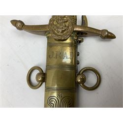  George V Naval Officers dirk inscribed Gieves, of regulation type, with 45.5cm steel etched blade including crowned fouled anchor, the Royal arms, cypher and the maker`s name, gilt-brass hilt the recurved cross-piece with acorn finials and crowned fouled anchor, wire-bound sharkskin-covered grip with lion's mask pommel; leather scabbard with engraved gilt-brass mounts inscribed with the monogram J.R.A.D. L62.5cm overall