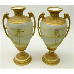  Pair Nippon type urn shaped vases, hand painted with a lake scene, gilded arms and borders, unmarked, H29cm   