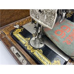 Singer 66 sewing machine in wooden case, together with an LG DVD player with speakers, two portable DVD players, etc 