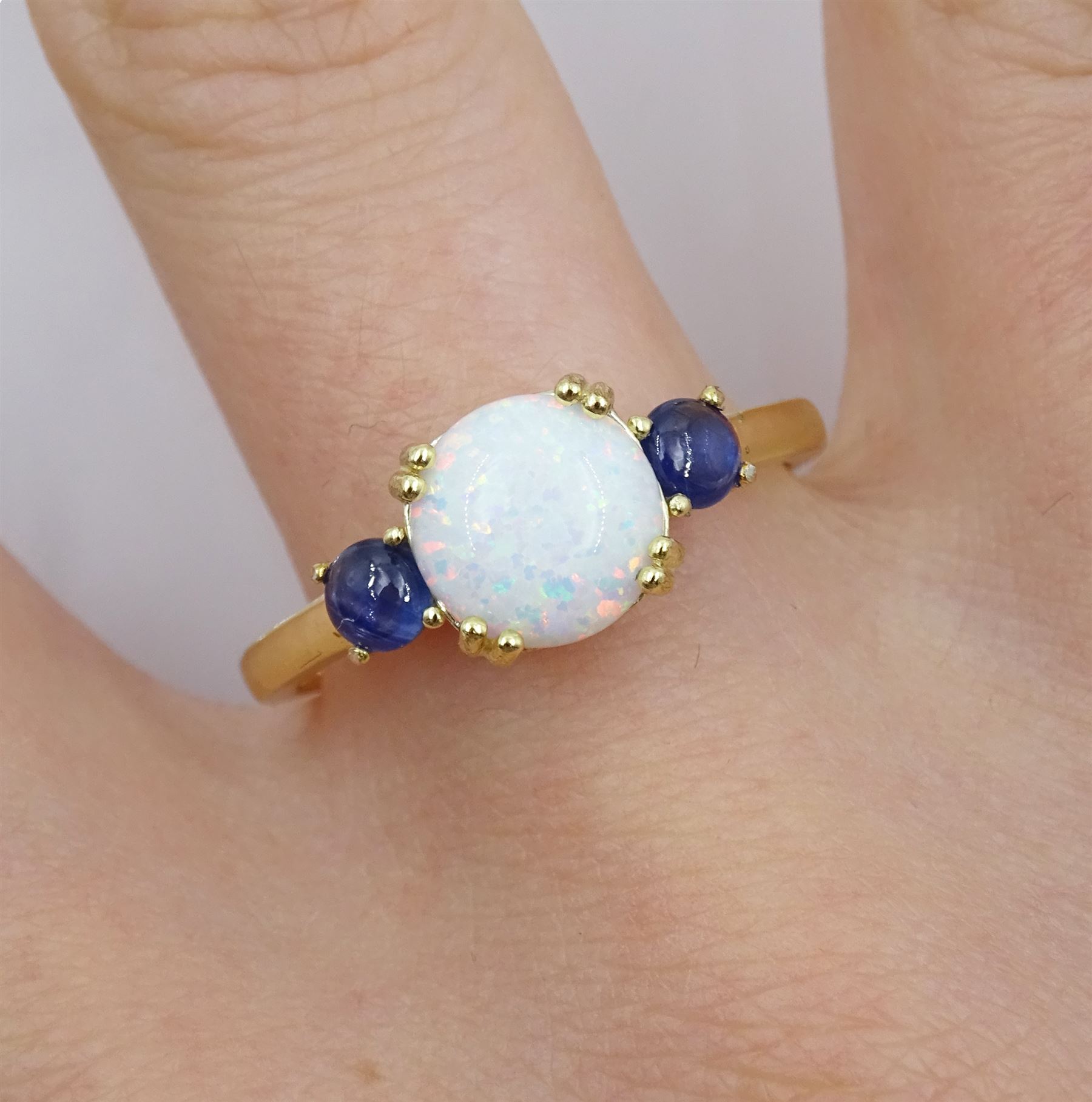 Silver-gilt three stone opal and sapphire ring, stamped 925