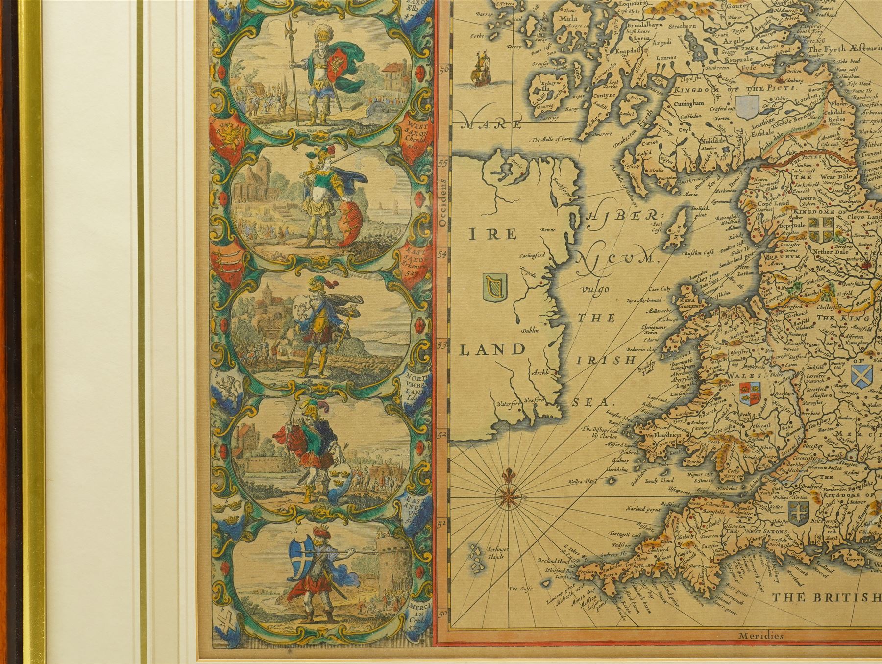 Johannes (Joan) Blaeu (Dutch 1571-1638): 'Britannia Prout Divisa fuit Temporibus Anglo-Saxonum Praesertim Durante Illorum Heptarchia' (Britain as it was Divided During the Anglo-Saxon Times), engraved map of the British Isles with hand-colouring and 14 Dutch style miniature vignettes depicting kings and scenes from Saxon history, later edition 43cm x 54cm