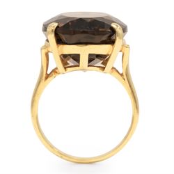 14ct gold smokey quartz ring, four claw set with a single oval cut quartz, stamped